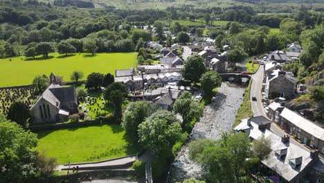 beddgelert village centre and church in snowdonia wales uk drone footage 4k