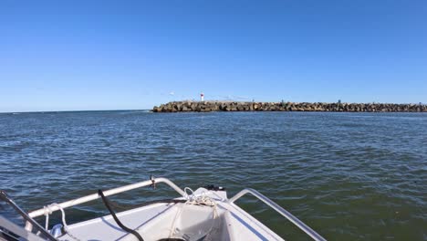 boat moving towards a jetty in gold coast