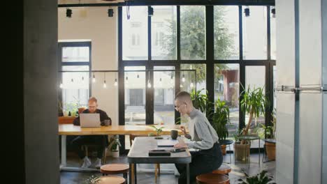 people working in a modern cafe