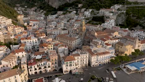 amalfi, italy at sunrise with drone video spinning shot of city