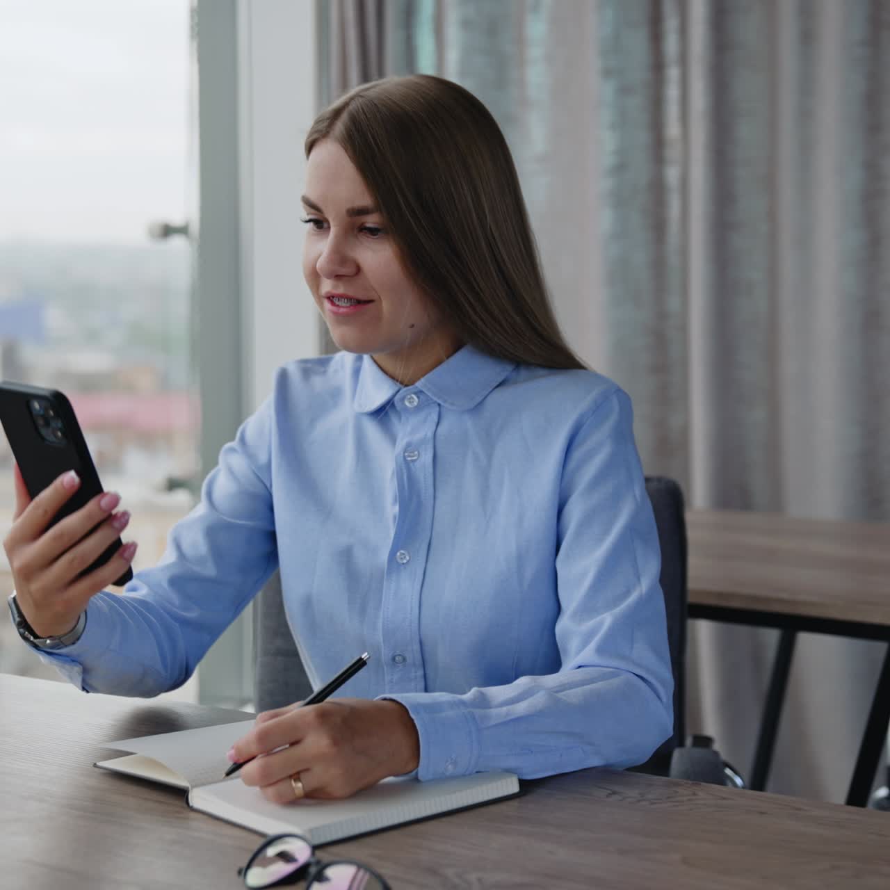 Business female manager with smartphone. Adult confident woman internet manager