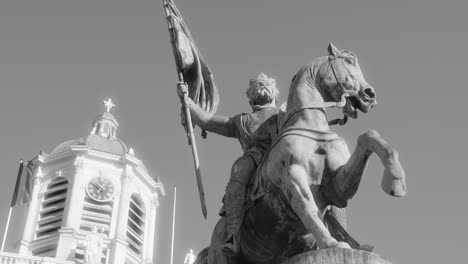 black and white - statue of godfrey of bouillon and bell tower of church of st