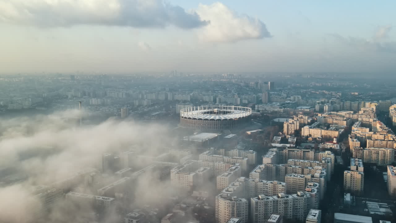 Cityscape of Bucharest from a drone, rows of residential buildings, thermal station with fog getting out and other the ground, ecology idea, Romania