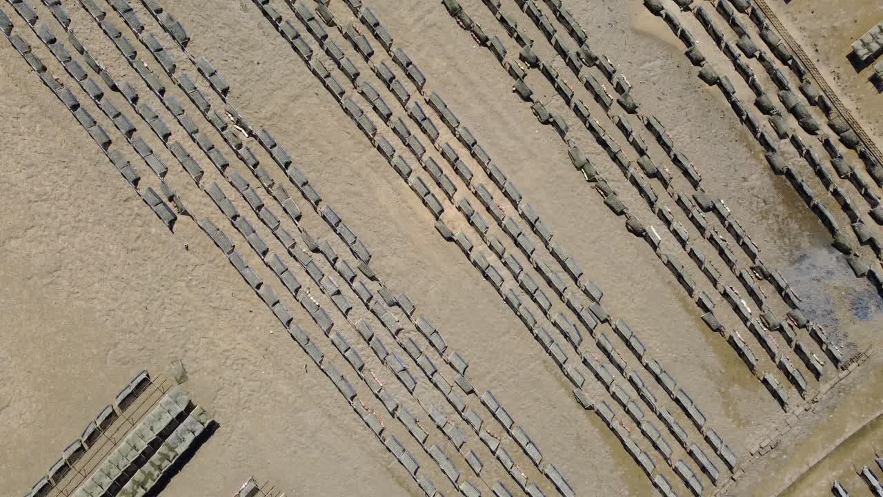 Ria Formosa riverbed with shellfish production and yachts anchored in the river