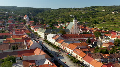 rotating drone shot of the church of holy trinity in svätý jur or saint george in bratislava, located in the bratislava region