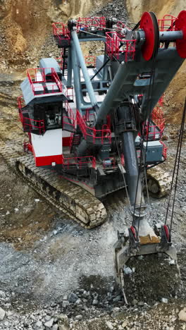 massive mining excavator at work in an open-pit mine