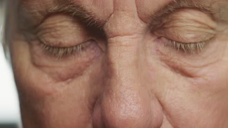 close-up-macro-eyes-elderly-woman-wearing-glasses-looking-tired