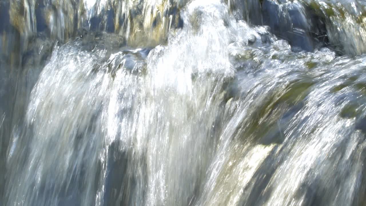Beautiful flowing waterfall in all directions on sunny day