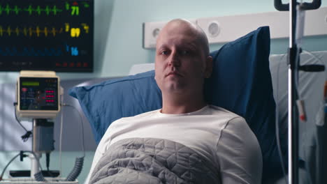 man in hospital bed