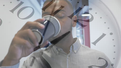 animation of clock over african american businessman drinking coffee