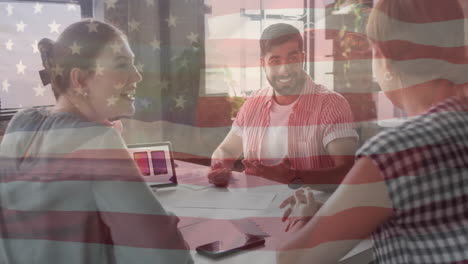 animation of flag of usa over diverse business people in office