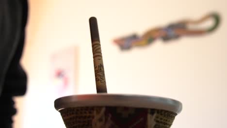 mate tea pouring in traditional argentinian mate cup