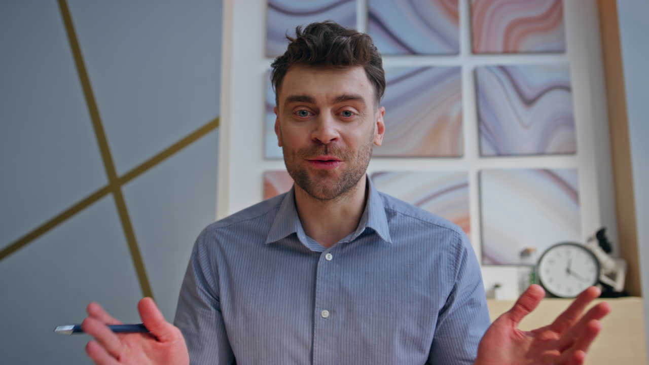 Cheerful online tutor talking video call in office closeup POV view. Man chat