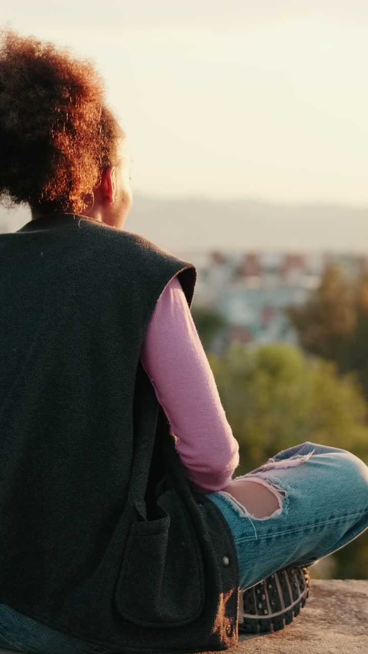 Woman Enjoys Sunset Over City Landscape