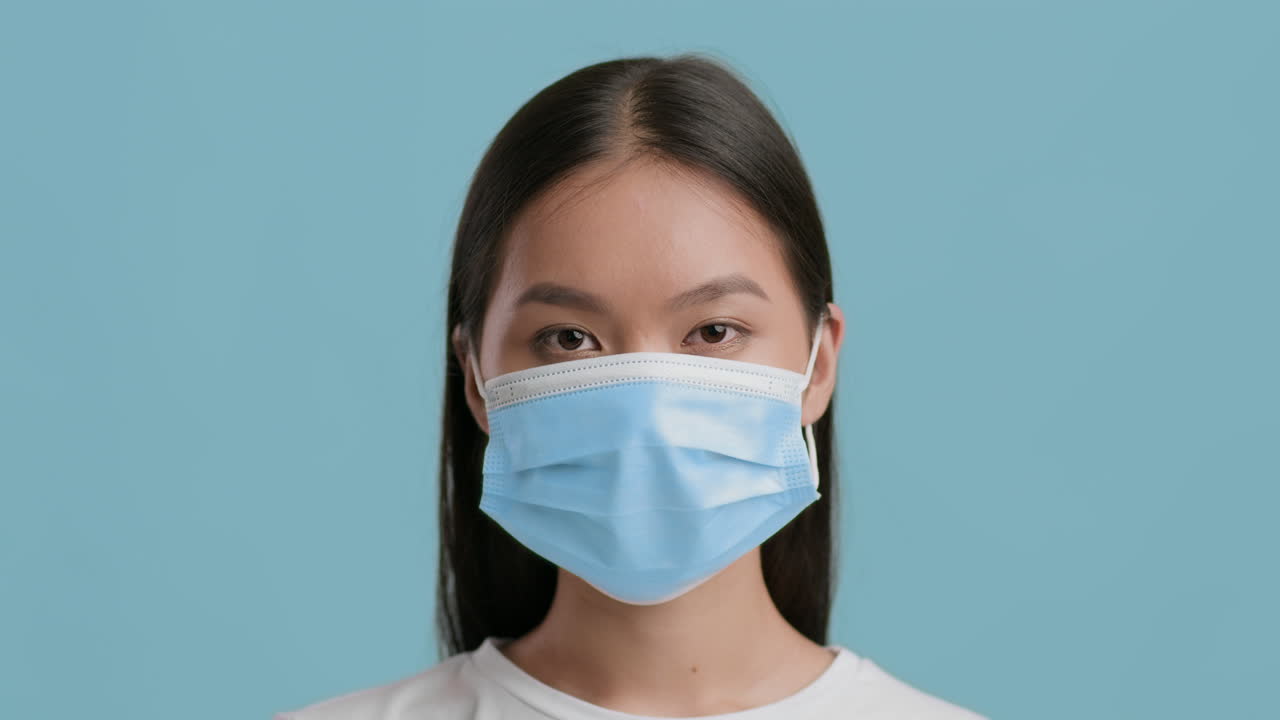 Young Asian Woman Wearing a Medical Mask for Protection