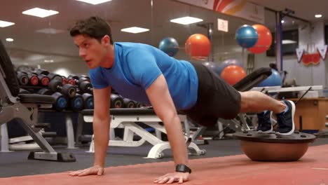 Man-doing-plank-position-on-bosu-ball