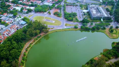 tilting aerial shot from high over lake in ibirapuera park of são paulo