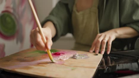 woman artist painting in studio