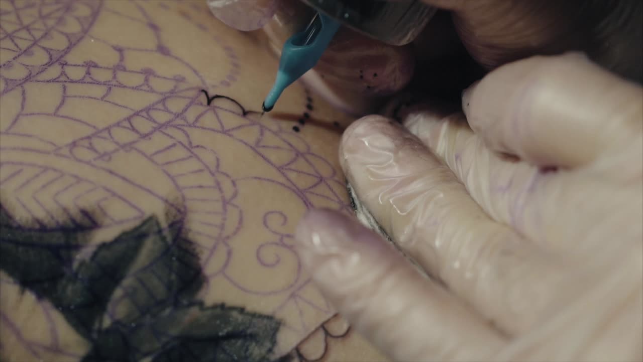 Tattoo Artist in Action on Mandala Design