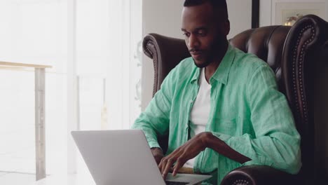 Young-adult-mixed-race-man-enjoying-time-at-home