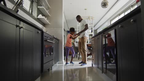 video of african american father and daughter preparing breakfast