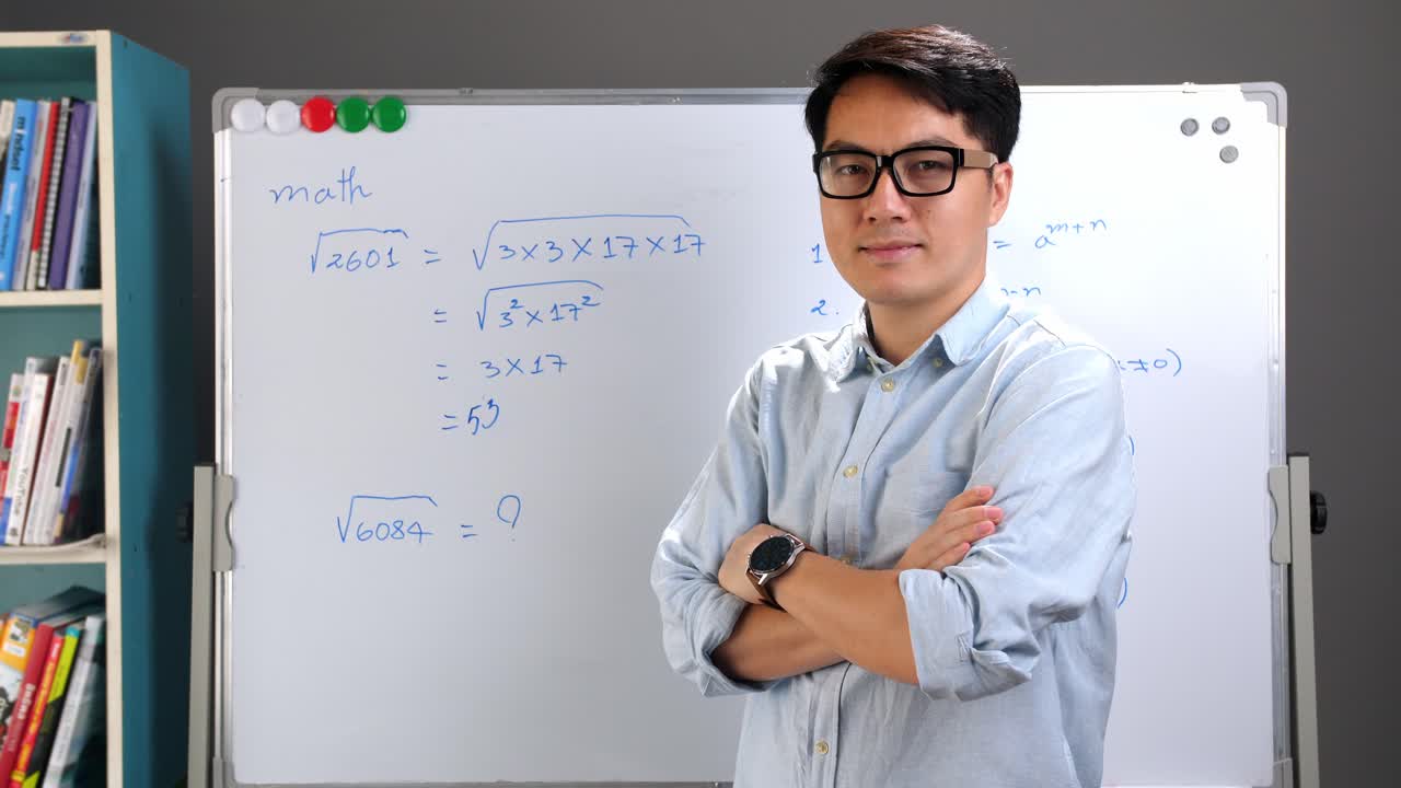 Male Asian Teacher With Whiteboard
