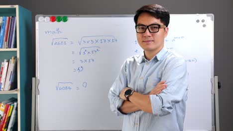 male asian teacher with whiteboard