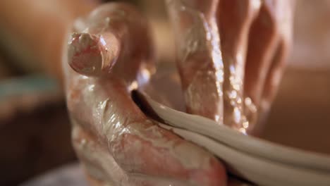 Hands-of-female-potter-making-a-pot