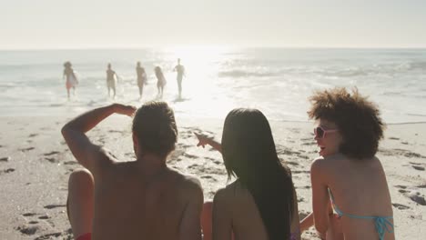 Friends-looking-at-the-view-with-surfboarders