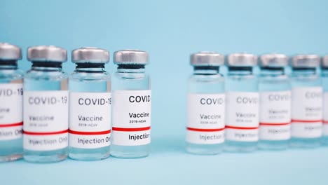 vial de vacunación covid 19, distribución y fabricación de la nueva cura coronavirus, línea de producción de vacunas