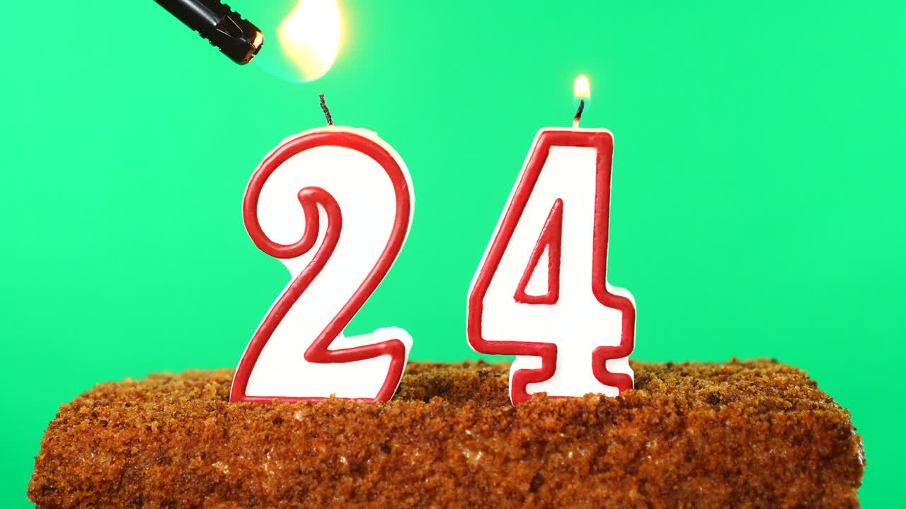 Cake with the number 24 lighted candle. Chroma key. Green Screen. Isolated