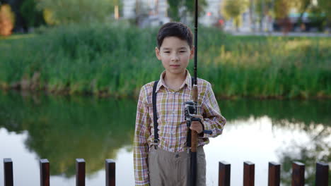 boy fishing in a park