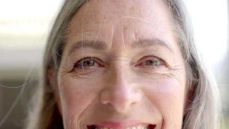 caucasian woman with smile lines showing happiness