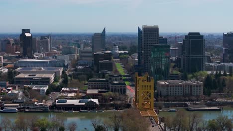 drone aerial shot of downtown sacramento with the tower bridge in view