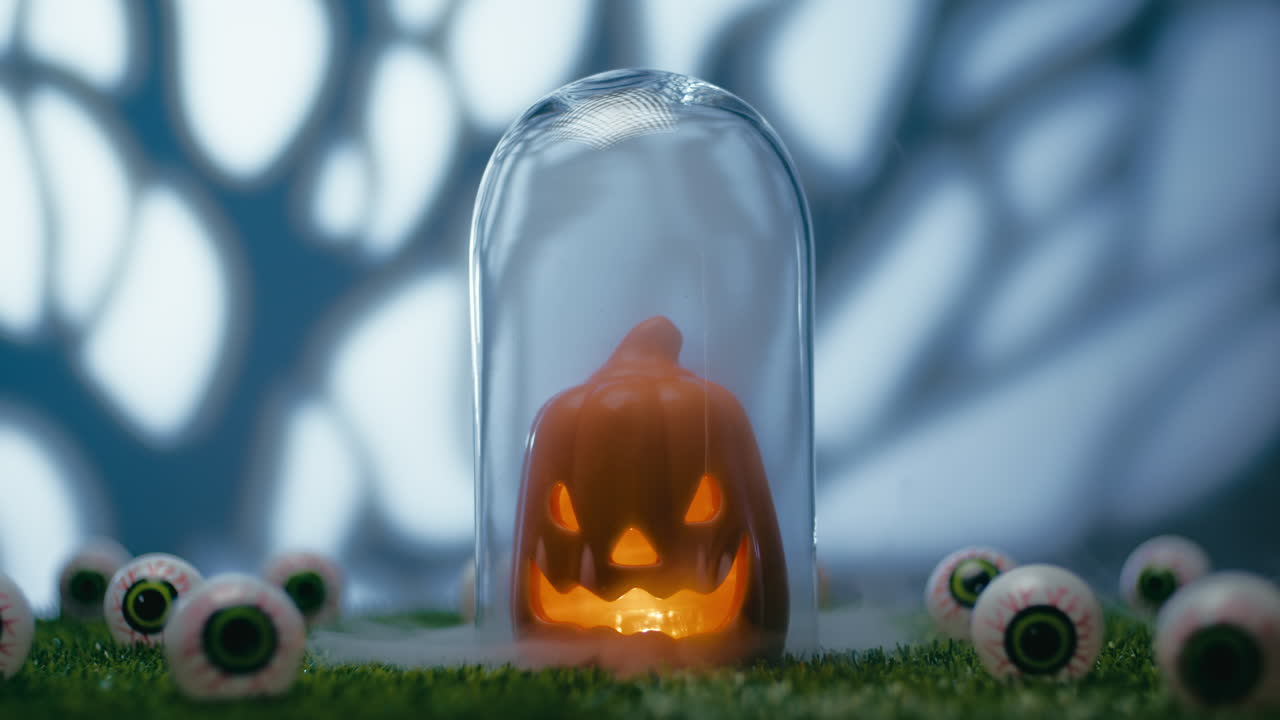 Halloween Pumpkin Amidst Scary Eyes On The Grass