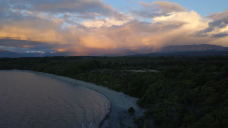 Aerial-view-of-calm-water-on-a-lake-shore-of-Lake-Te-Anau-in-New-Zealand