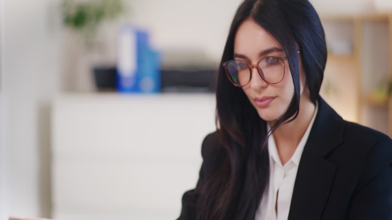 Woman Typing on Laptop Engaged in Project