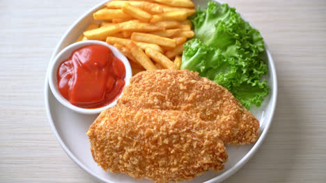 fried chicken breast fillet steak with french fries and ketchup