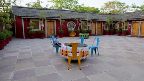 colorful artistic designed traditional teak and bush home at evening