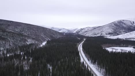 Lush-Green-Wooded-Aerial-Landscape-of-Alaska-Wilderness,-Wintertime,-Chena-Hot-Springs-Road