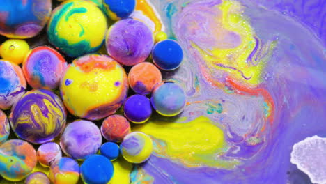 abstract colorful spheres in fluid art