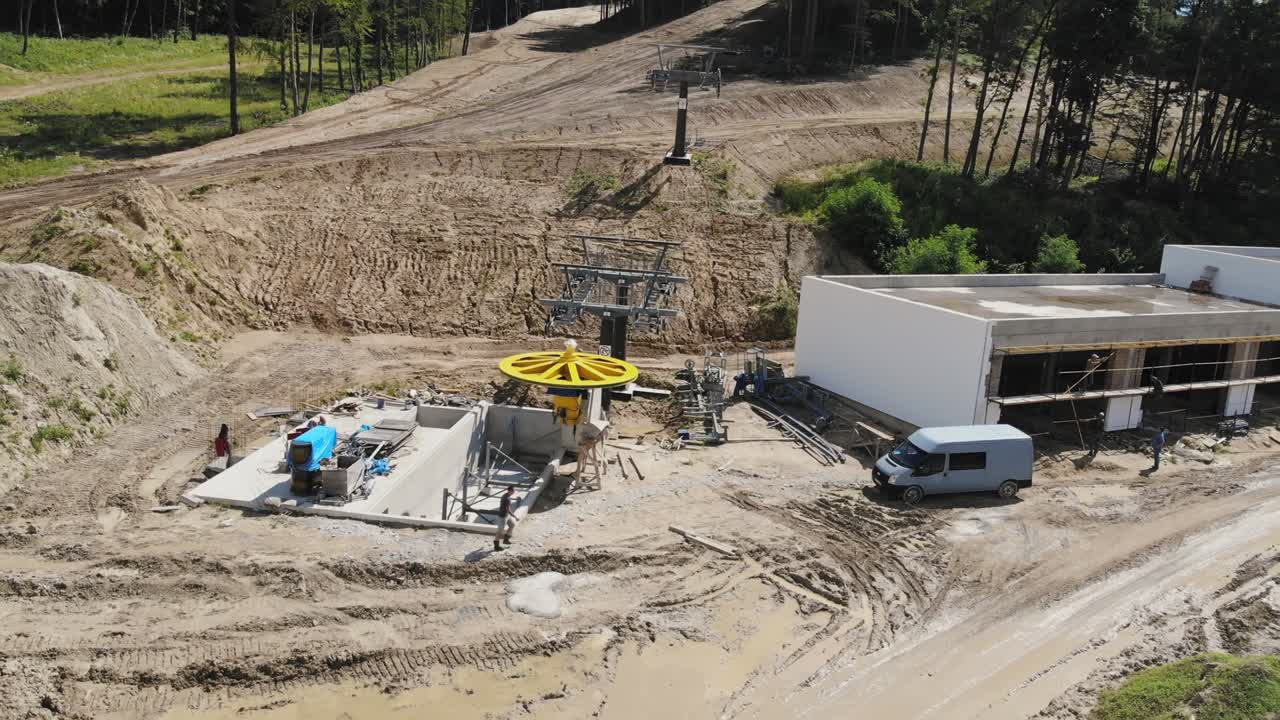 Construction of a ski lift in summer. The lower extract of the station is under development