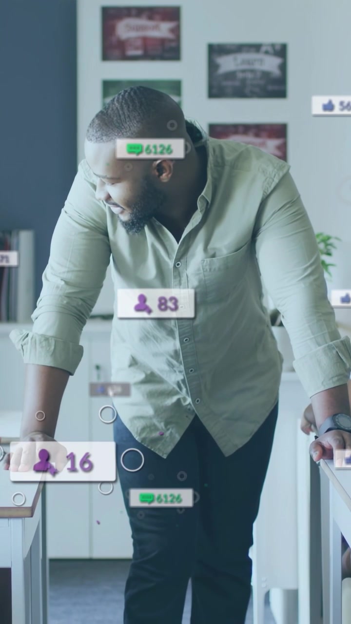 Vertical video: Teacher leaning forward and speaking in class, updating metrics badges to teach