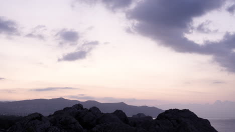 Time-Lapse-Video-Cloudy-Sky-Golden-Hour-Sunrise-Over-Ocean-Early-Summer-Morning