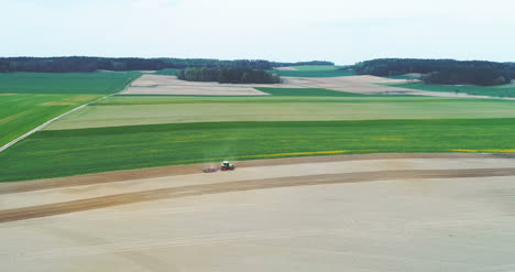 Top-View-Of-Farmer-Working-On-Farmland-