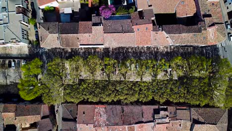 aerial top view of residential house roofs in medieval town of montgnac