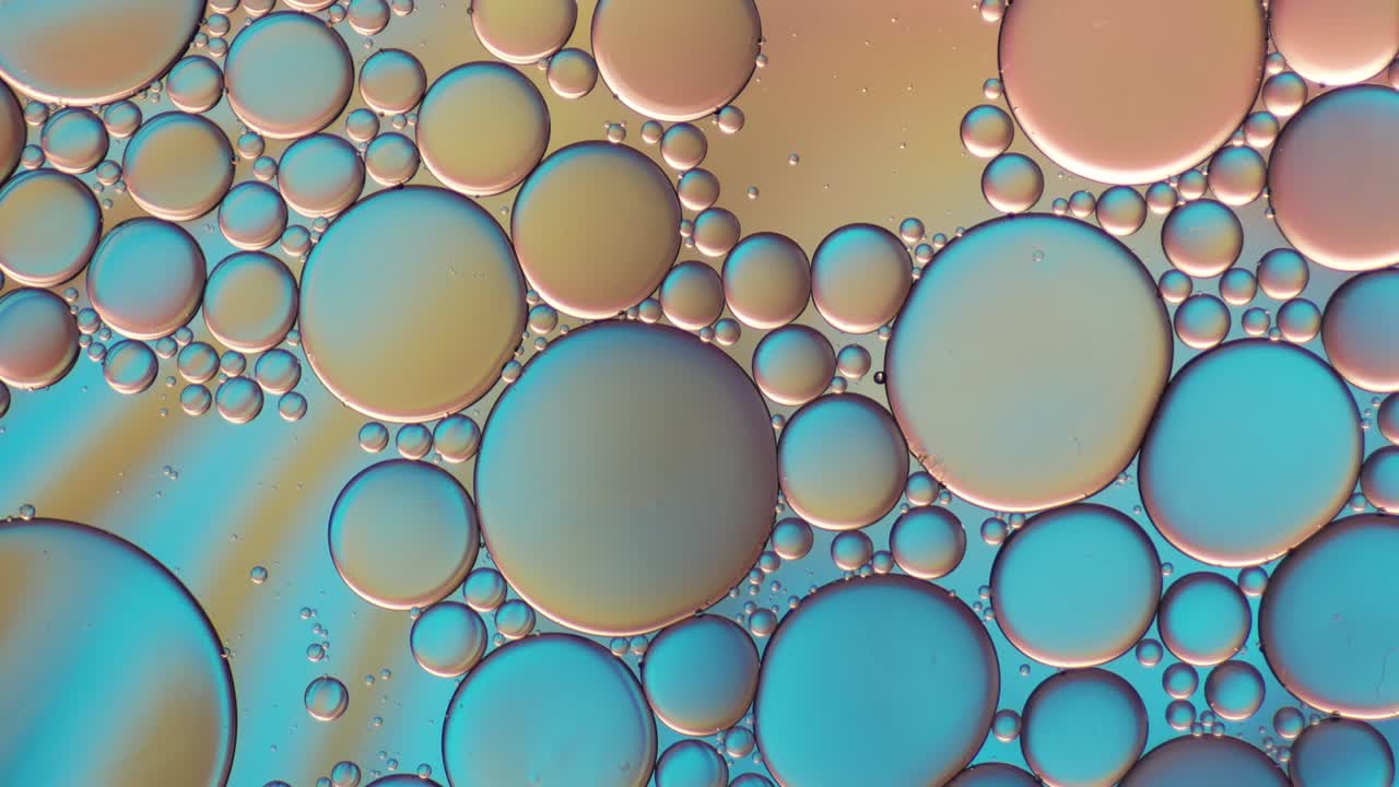 물 위에 떠다니는 기름방울의 다채로운 예술적. 추상적인 거품 배경