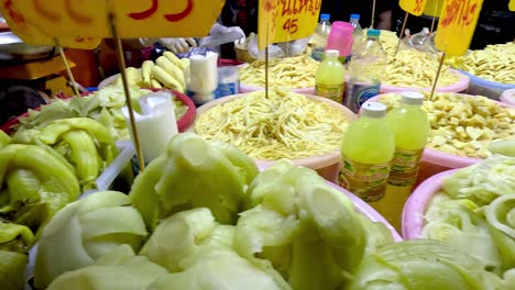 colorful display of pickled vegetables at market