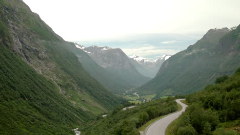 Zigzag-Road-Rv15-Near-The-Town-Of-Stryn-With-A-View-Of-Mountain-Range-In-Norway
