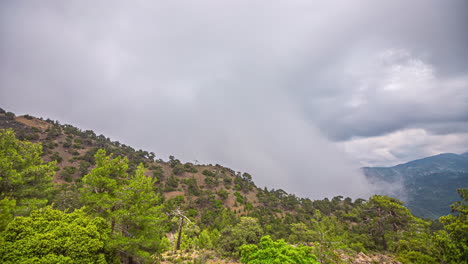 Time-lapse-shot-of-rising-clouds-against-a-mountainside